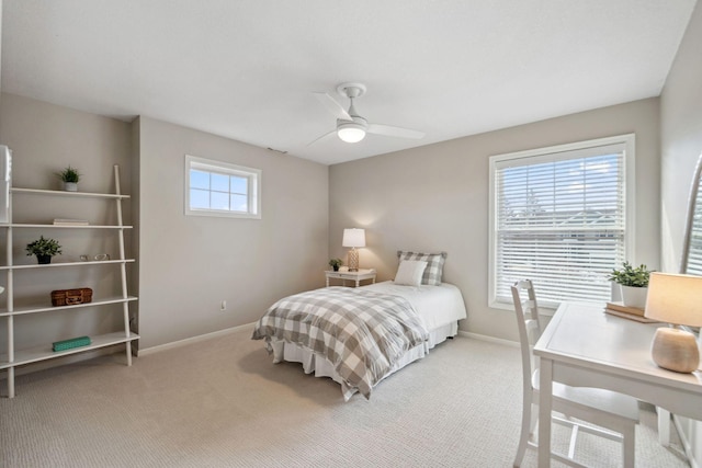 carpeted bedroom with baseboards and ceiling fan