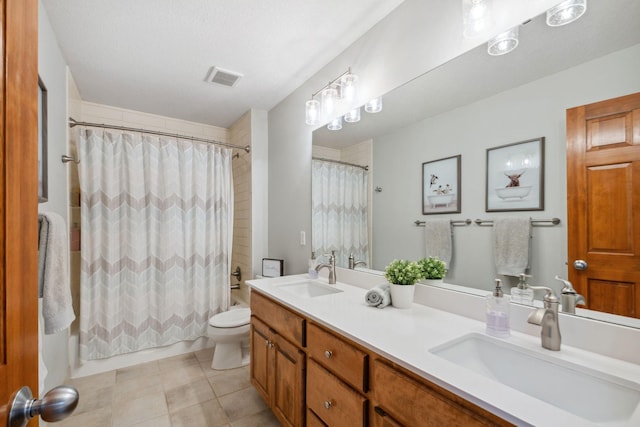 full bath with a sink, visible vents, shower / bath combo with shower curtain, and toilet