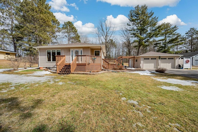 view of front of house featuring crawl space, a wooden deck, an outdoor structure, and a front lawn