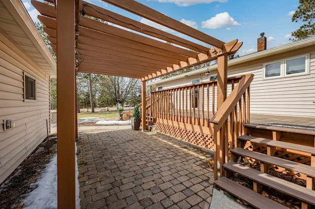 view of patio featuring a deck and a pergola