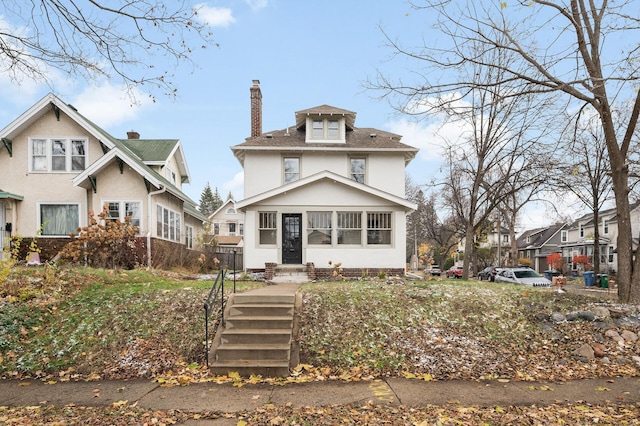 traditional style home with a chimney