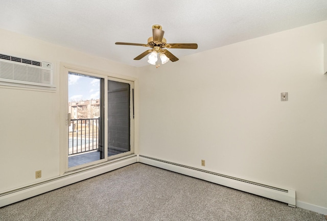 spare room featuring a textured ceiling, a wall unit AC, carpet floors, a baseboard radiator, and ceiling fan