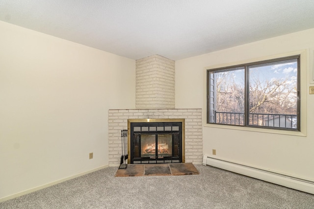 interior space featuring a textured ceiling, carpet flooring, a baseboard radiator, baseboards, and a brick fireplace