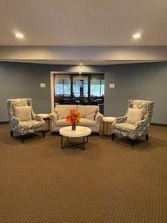 living room featuring carpet flooring and recessed lighting