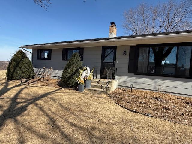 ranch-style house with a chimney