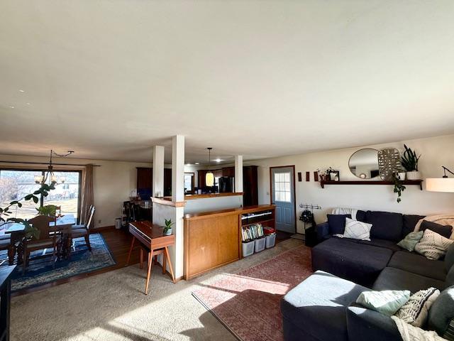 living room with carpet flooring and a healthy amount of sunlight