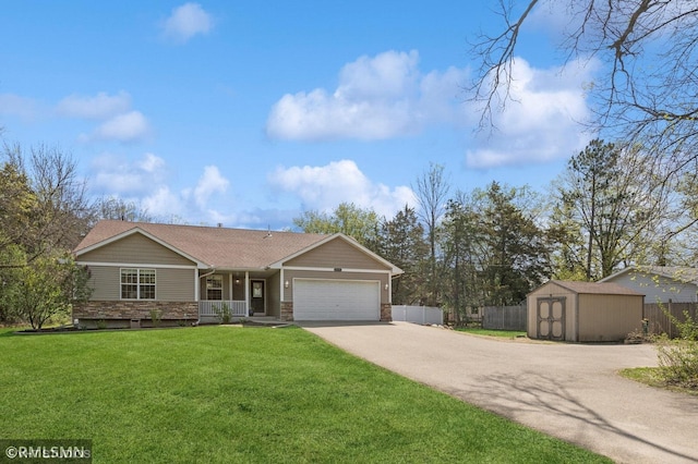 28942 Dawson Ave, Randolph, MN 55065 - ranch-style house with driveway, a storage unit, a garage, stone siding, and a porch
