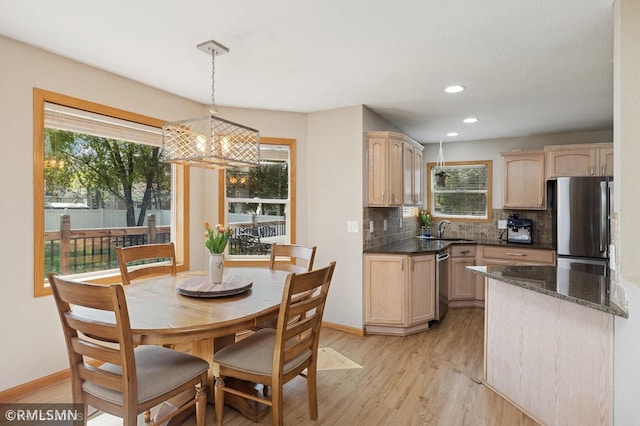 28942 Dawson Ave, Randolph, MN 55065 - kitchen with stainless steel appliances, light brown cabinetry, a sink, plenty of natural light, and recessed lighting