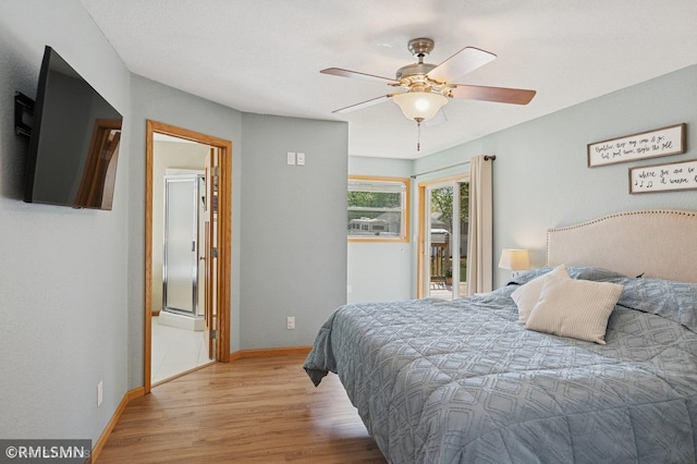 28942 Dawson Ave, Randolph, MN 55065 - bedroom with wood finished floors, baseboards, a ceiling fan, and access to outside