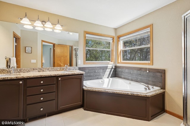 28942 Dawson Ave, Randolph, MN 55065 - bathroom with a bath, double vanity, tile patterned flooring, and a shower with door