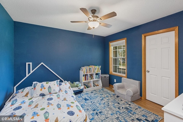 28942 Dawson Ave, Randolph, MN 55065 - bedroom with wood finished floors and a ceiling fan