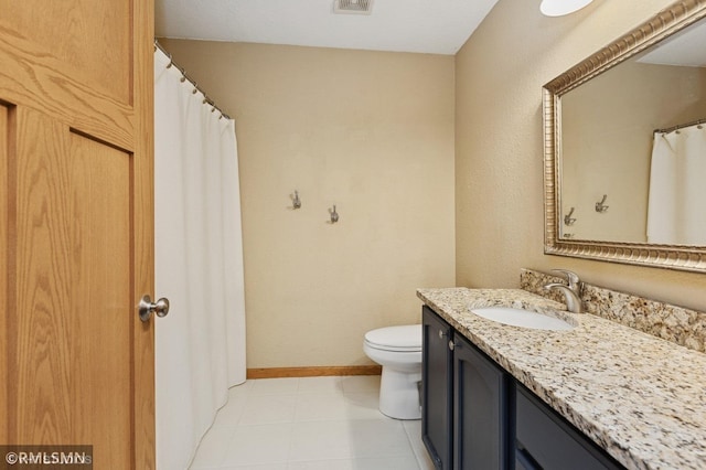 28942 Dawson Ave, Randolph, MN 55065 - bathroom featuring toilet, vanity, and baseboards