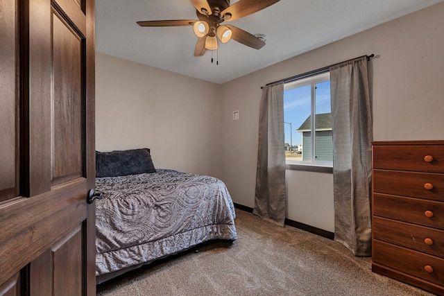 carpeted bedroom featuring a ceiling fan