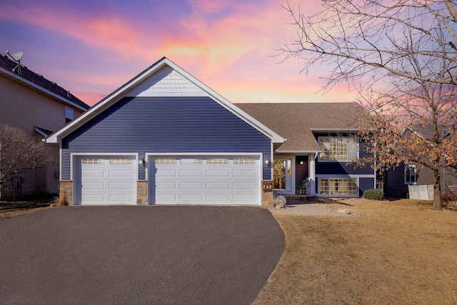 view of front of property featuring a garage and driveway