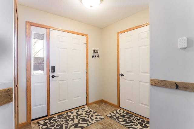 foyer entrance with baseboards