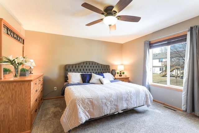 bedroom featuring visible vents, baseboards, a ceiling fan, and carpet flooring