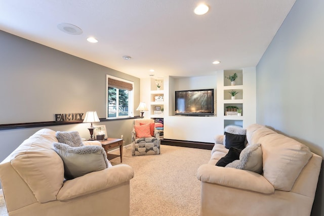 living room featuring built in features, carpet, recessed lighting, and baseboards