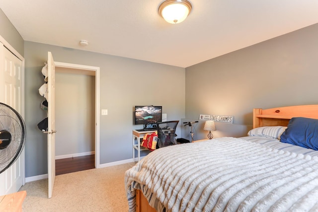 carpeted bedroom with baseboards