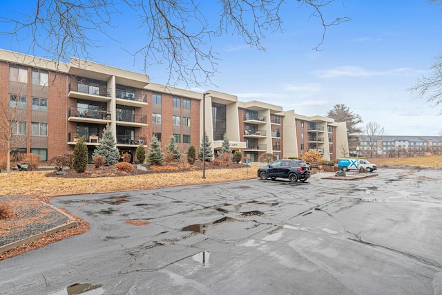 view of property featuring uncovered parking