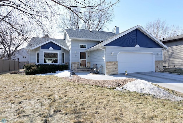 ranch-style home with brick siding, fence, concrete driveway, a chimney, and an attached garage