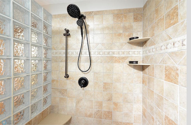 full bath with tiled shower