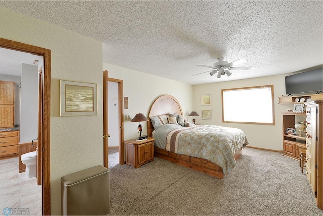 bedroom with light colored carpet, a textured ceiling, and ceiling fan