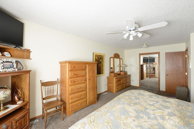 bedroom with light carpet, a ceiling fan, baseboards, and a textured ceiling