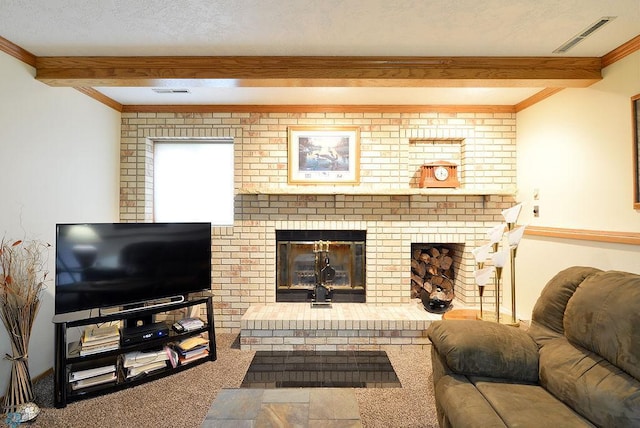 living area with visible vents, beamed ceiling, a fireplace, and carpet flooring