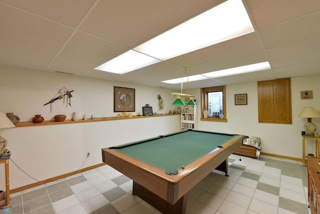 game room with baseboards, a paneled ceiling, light floors, and pool table