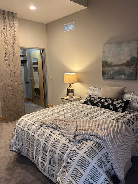 bedroom featuring visible vents and carpet flooring