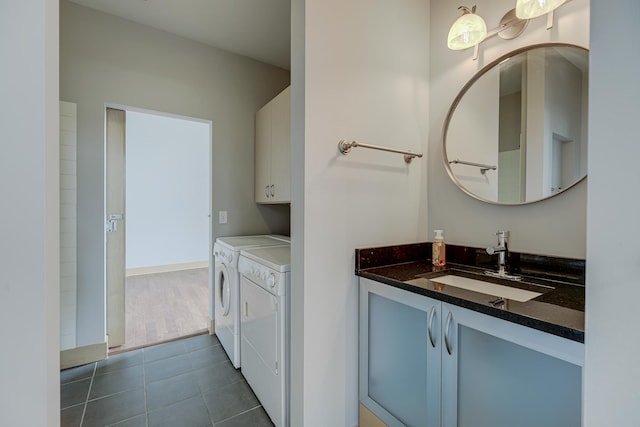 bathroom featuring washer and dryer, tile patterned floors, and vanity