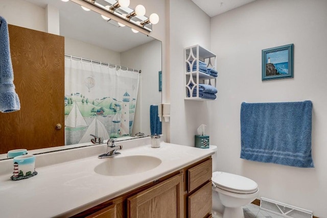 bathroom with vanity, toilet, a shower with curtain, and visible vents