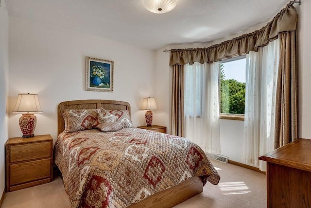 bedroom featuring carpet and visible vents