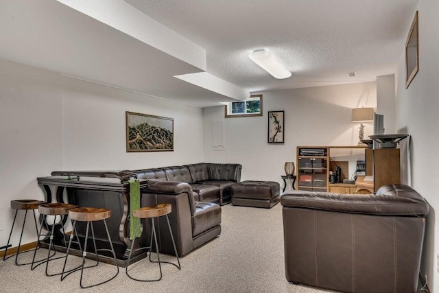 carpeted living room featuring a textured ceiling