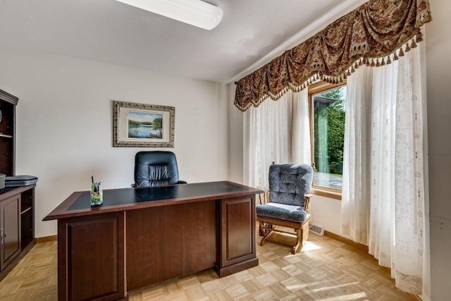 home office featuring visible vents and baseboards