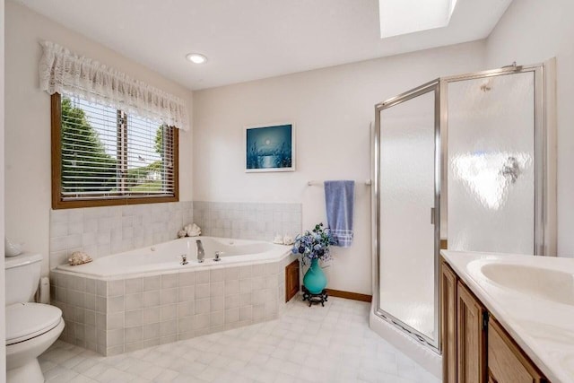 bathroom with vanity, a garden tub, a shower stall, and toilet