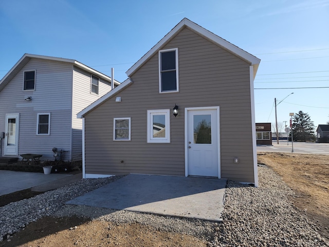 rear view of property featuring a patio area