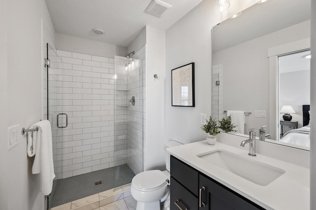 full bath with visible vents, toilet, a textured ceiling, a shower stall, and vanity