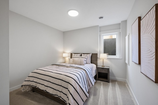 bedroom with visible vents, baseboards, and carpet floors