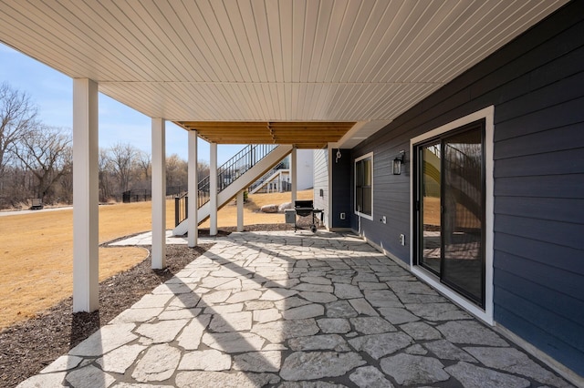 view of patio / terrace featuring stairway