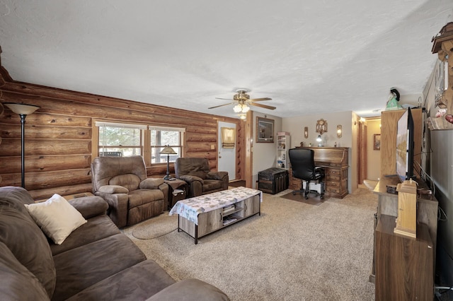 carpeted living room featuring rustic walls, a textured ceiling, and ceiling fan