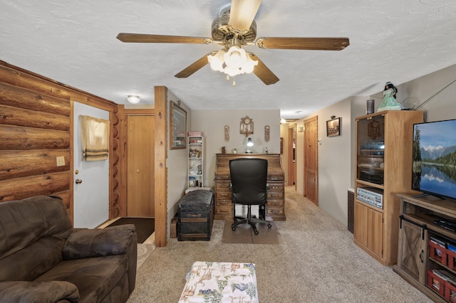 office space featuring visible vents, light carpet, a textured ceiling, log walls, and ceiling fan