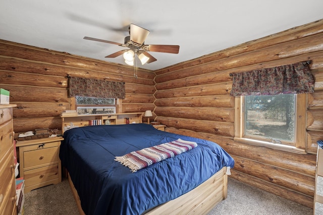 bedroom with log walls and carpet floors