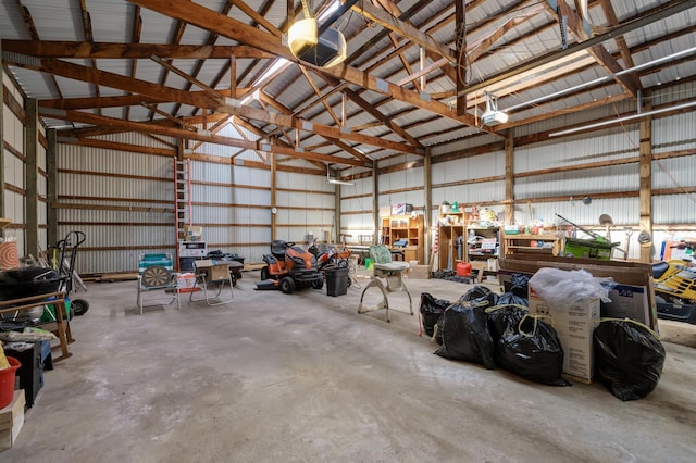 garage featuring a garage door opener and metal wall