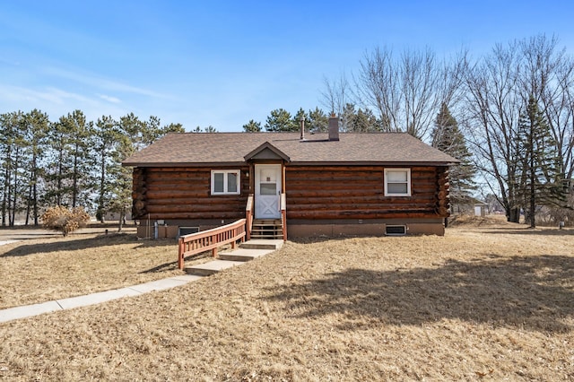 log cabin featuring log siding, a shingled roof, and entry steps