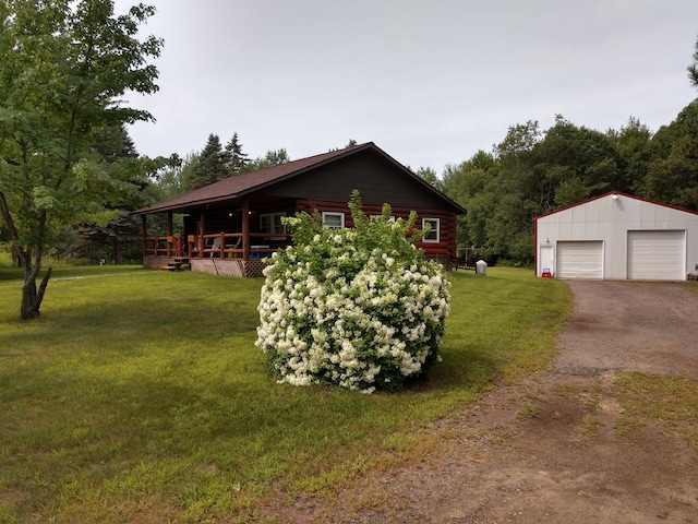 view of home's exterior with an outbuilding, a garage, and a yard