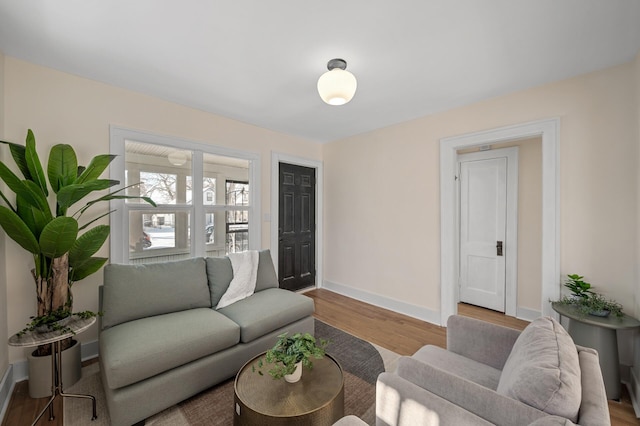 living room featuring wood finished floors and baseboards