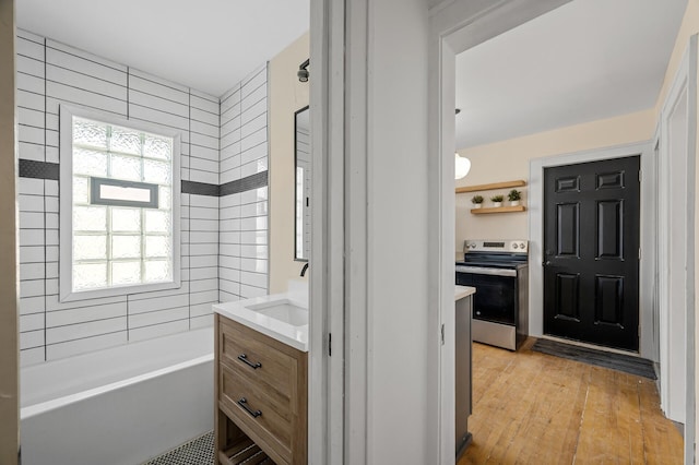 full bathroom with hardwood / wood-style floors and vanity