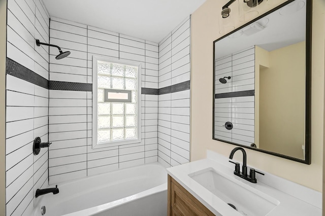 full bath with a wealth of natural light, bathtub / shower combination, and vanity