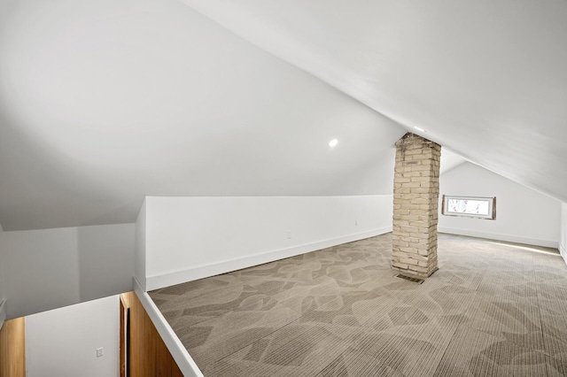 bonus room with visible vents, baseboards, carpet floors, lofted ceiling, and decorative columns